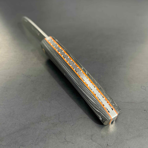 Liadou Exception in carbon fibre/brass inserts & Chiselled plates