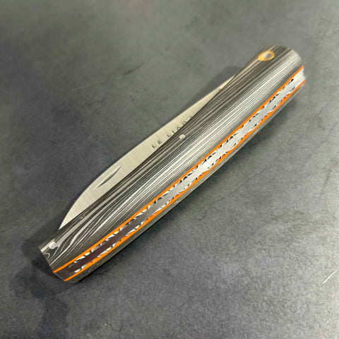 Liadou Exception in carbon fibre/brass inserts & Chiselled plates