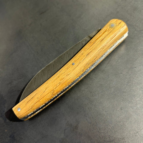 Liadou Exception in Cask Oak with Chiselled Plates & Damascus Blade