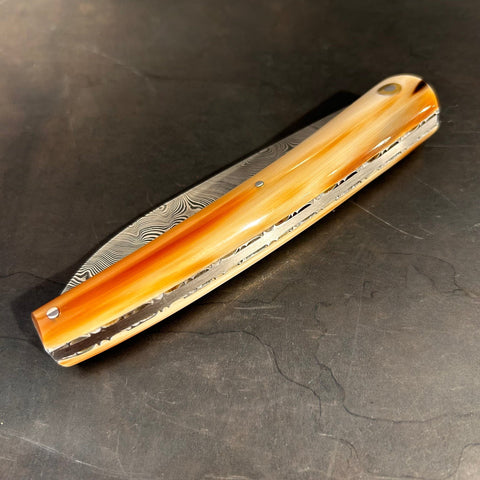 Liadou Exception in Marbled Horn Tip, Chiseled Plates & Stainless Steel Damascus Blade